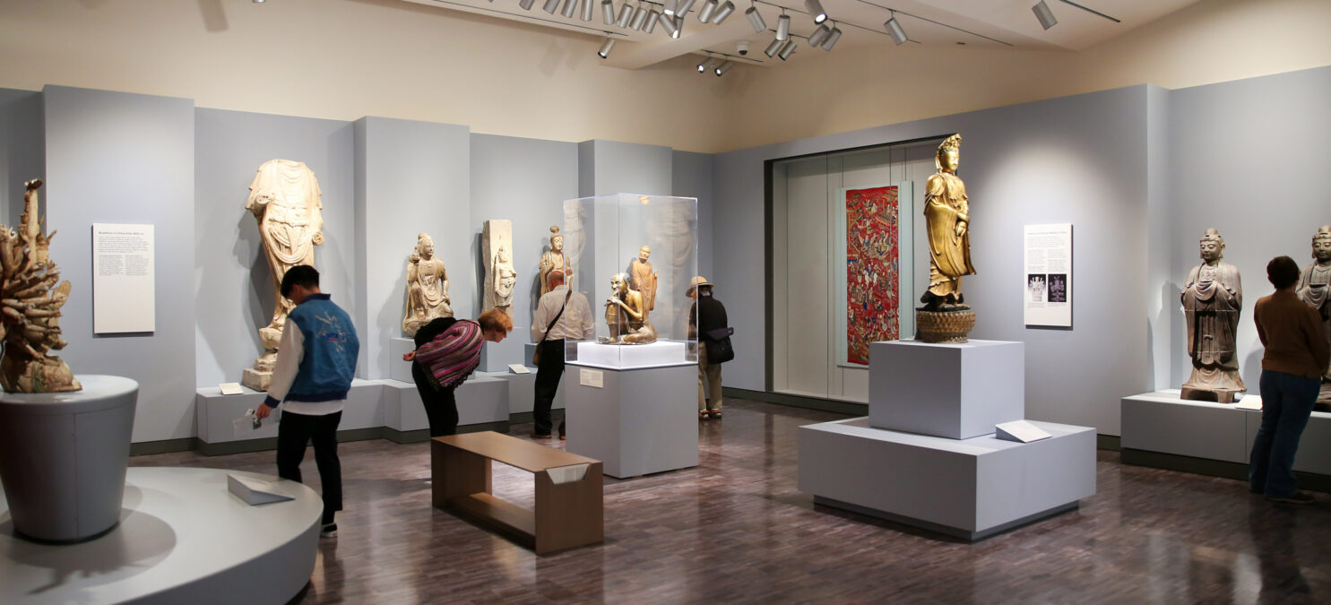 Museum visitors look at artwork in the China galleries.