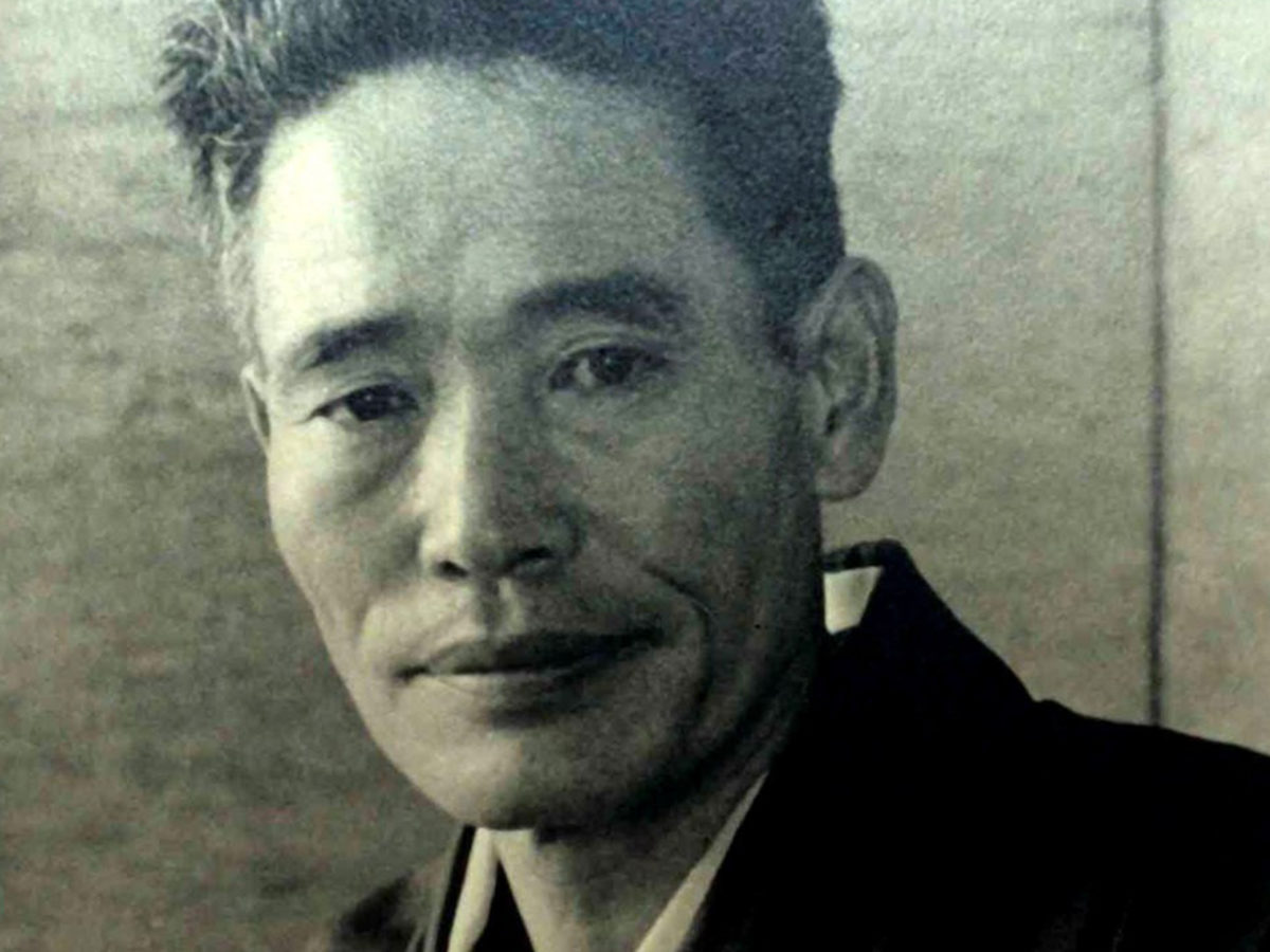 Black and white headshot of a man.