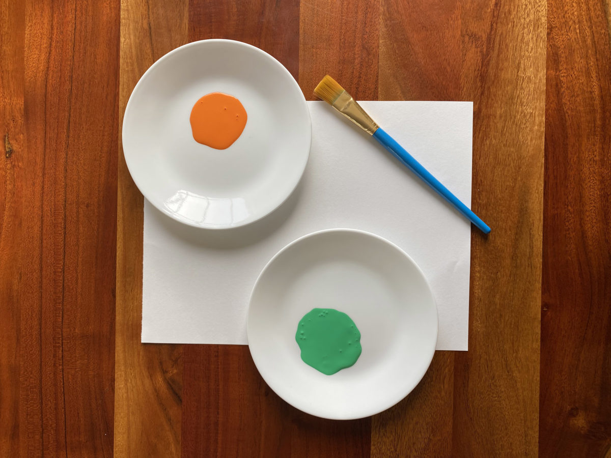 Detail view of painted vegetable stamp activity.